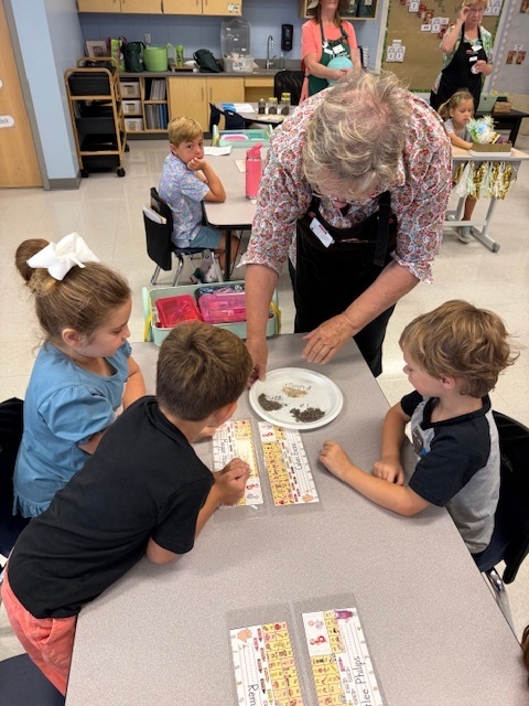first graders working with the master gardeners 