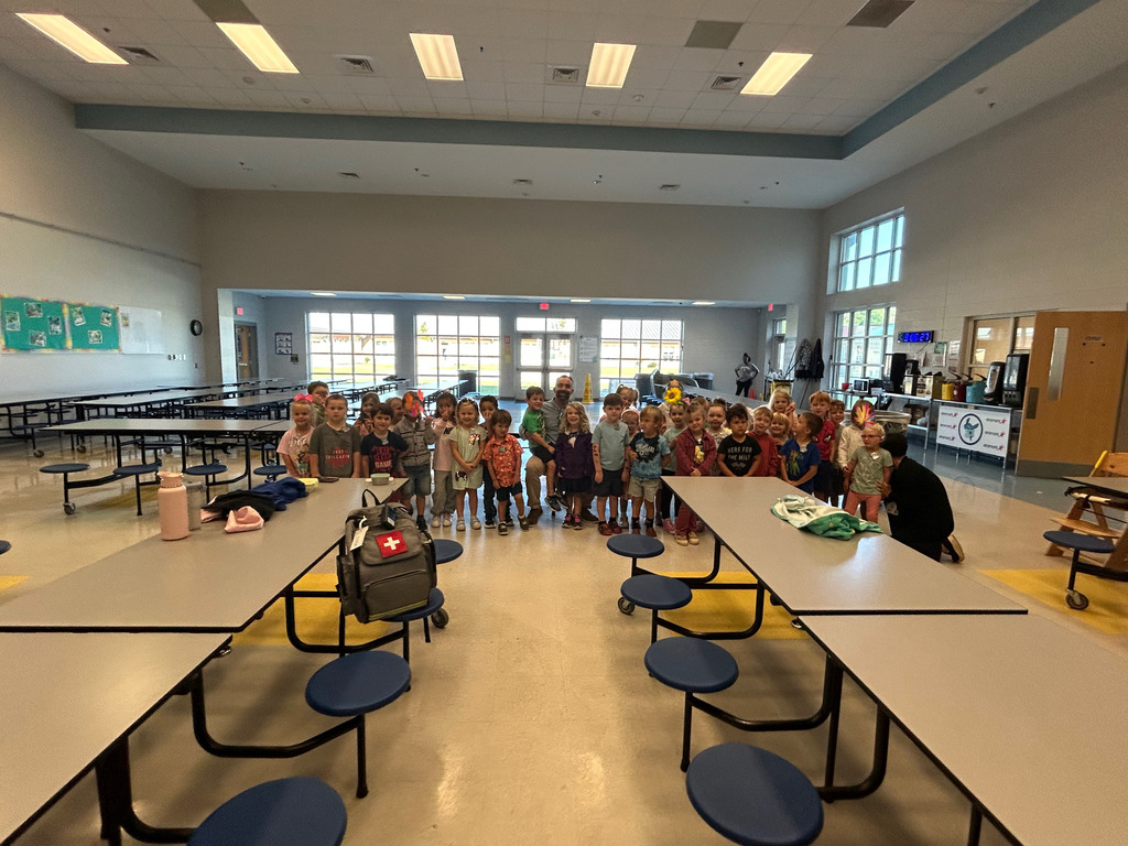 PreK classes standing next to a parent speaker