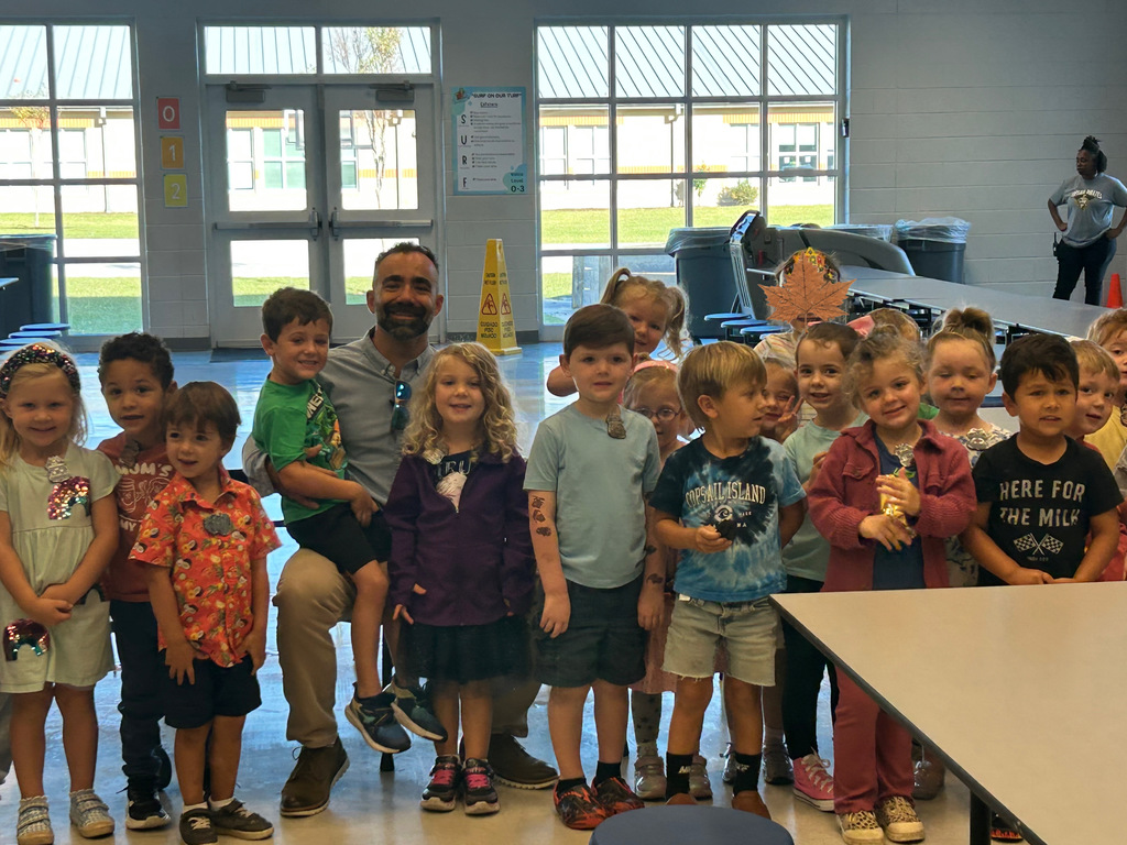 PreK classes standing next to a parent speaker