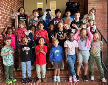 students of the week with silly faces and gestures being made