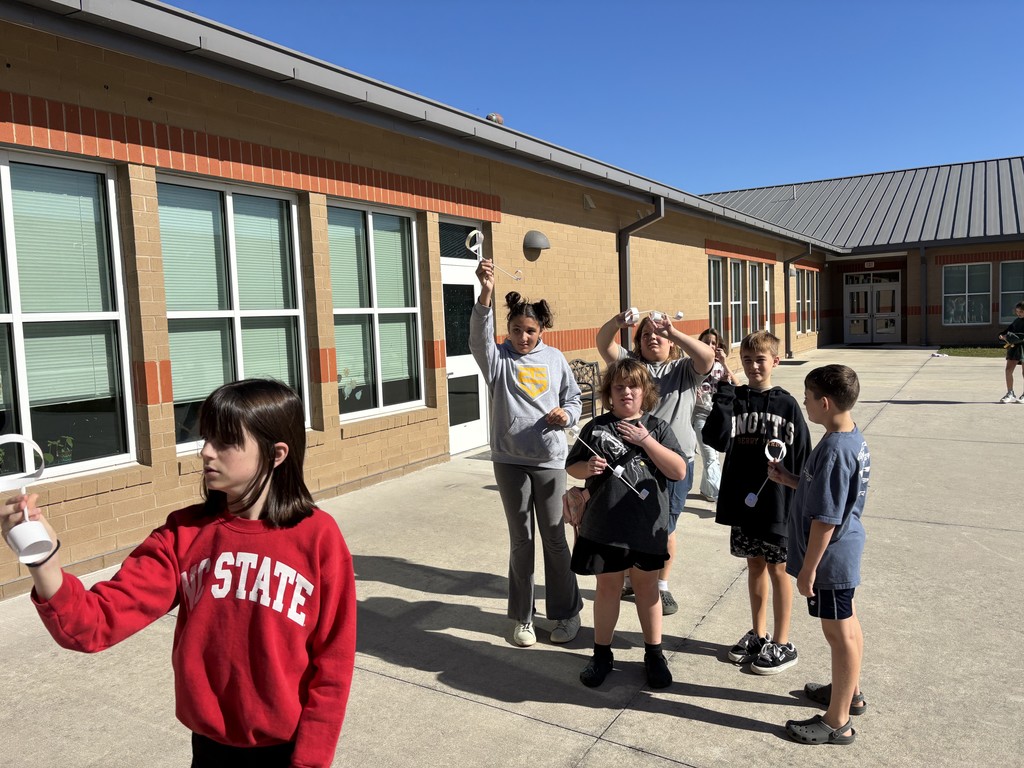 5th graders outside testing their hoop gliders