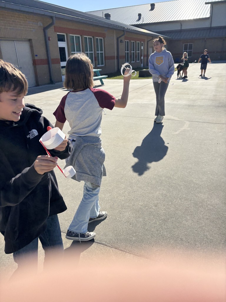 5th graders outside testing their hoop gliders