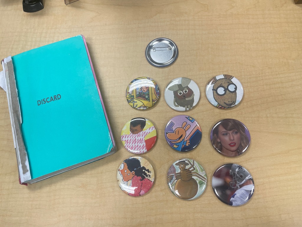 discarded library books being turned into buttons 