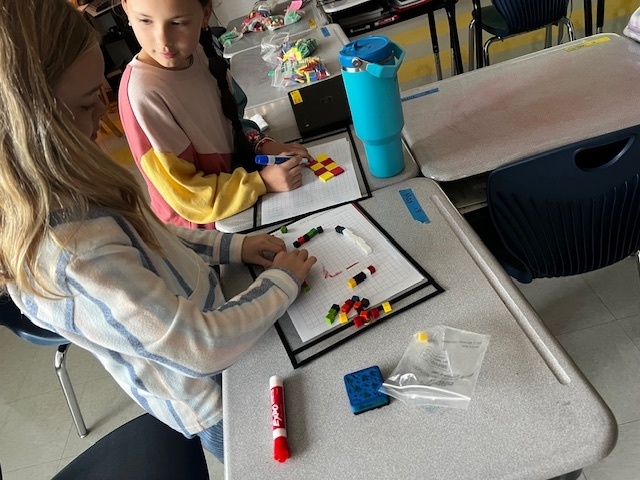 4th grade students working a perimeter and area math project