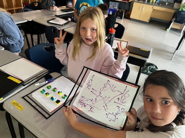 4th grade students working a perimeter and area math project
