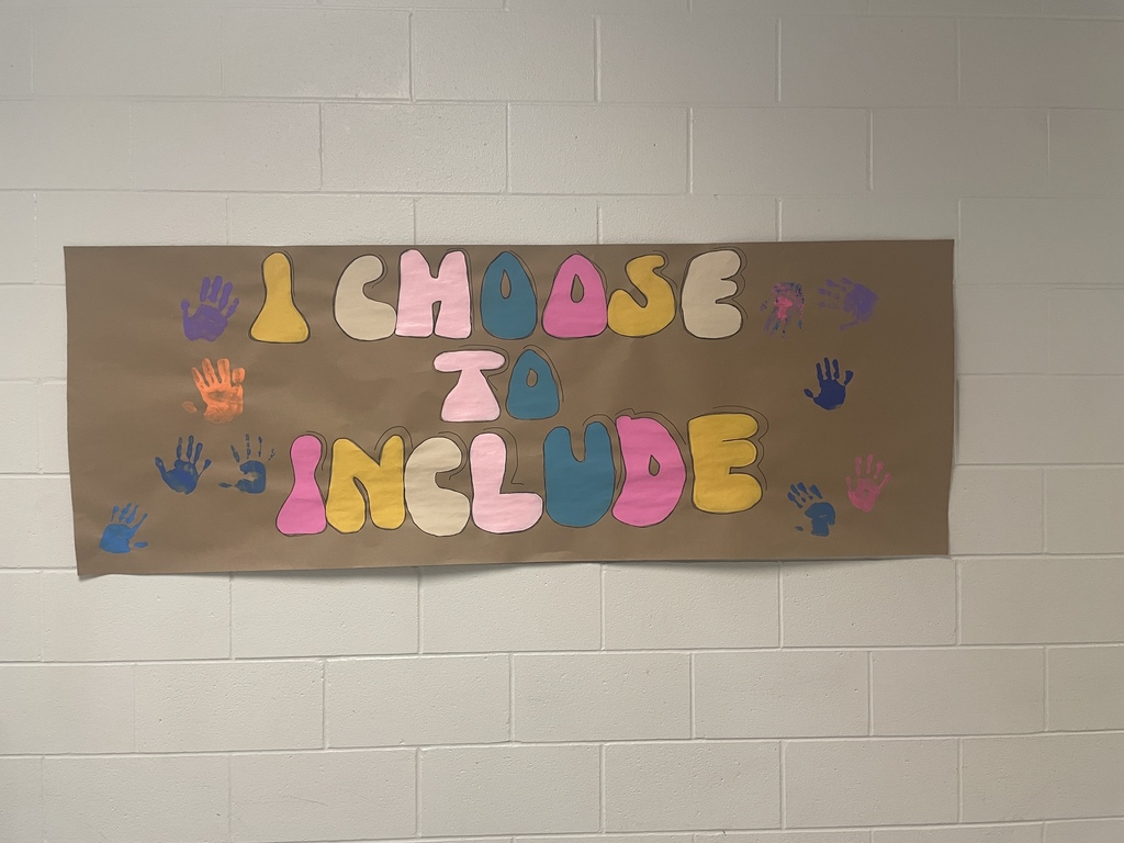 I choose to include sign hanging on the wall