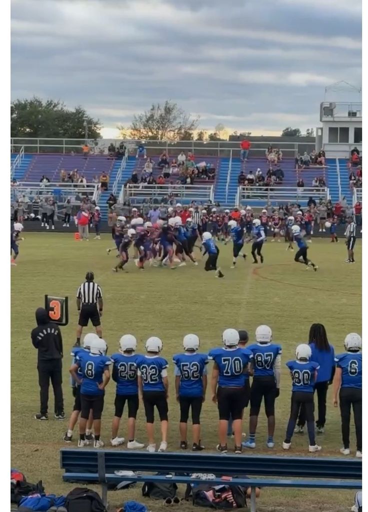 The team watches during a play.