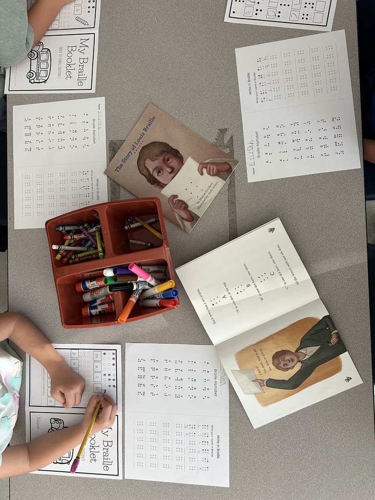 students translating names & words into braille
