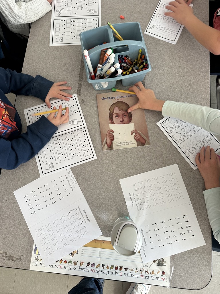 students translating names & words into braille