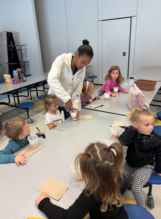 prek students eating apple pie in a cup