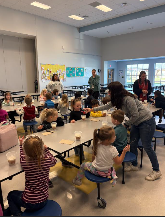 prek students eating apple pie in a cup