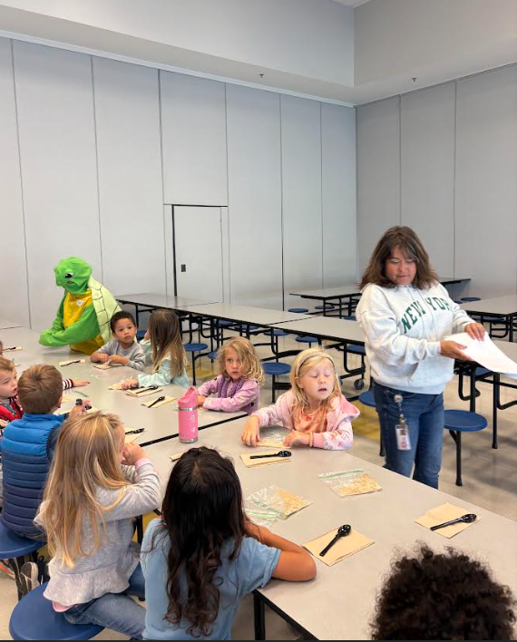 prek students eating apple pie in a cup