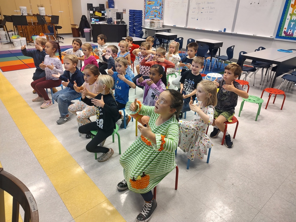 Kindergarten hand signing solfege in music class