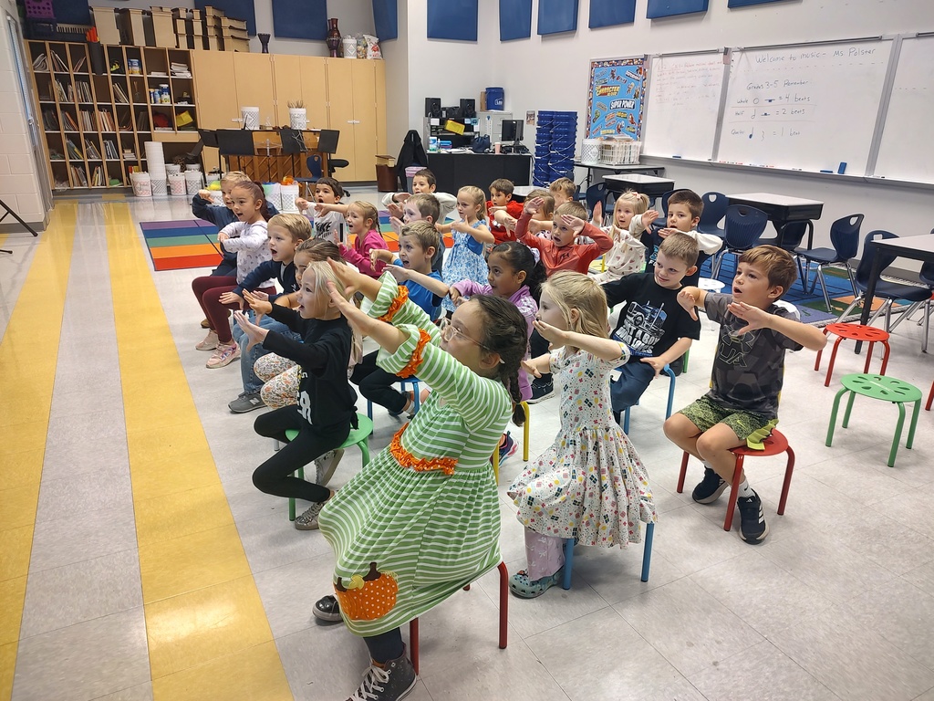 Kindergarten hand signing solfege in music class