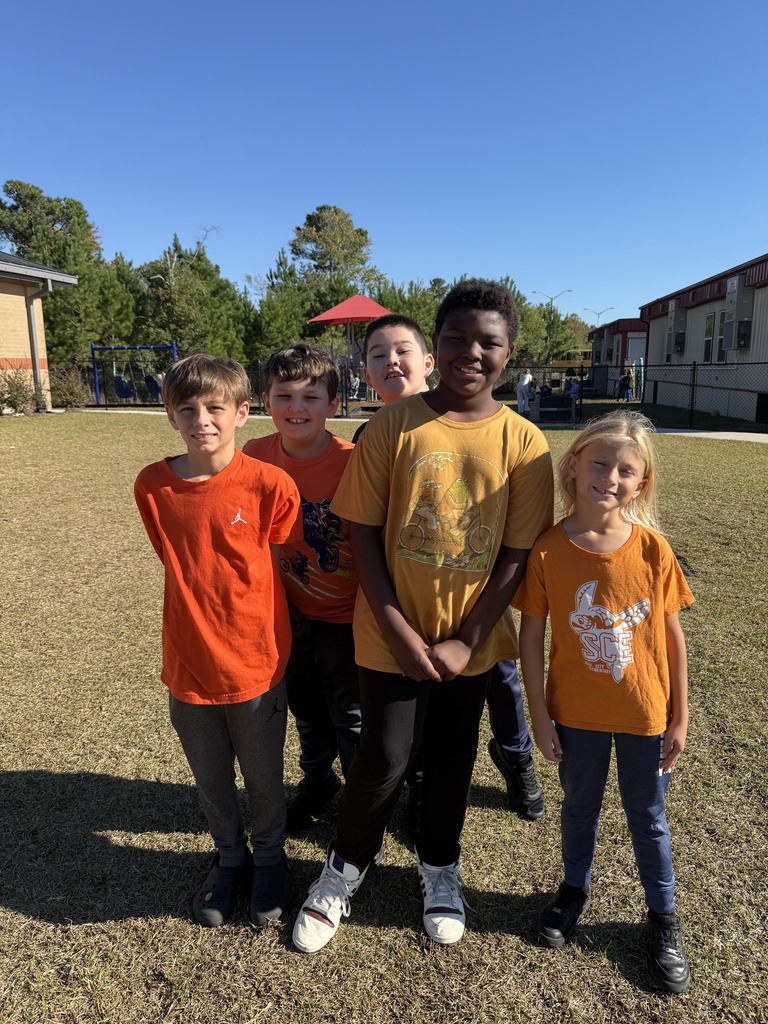 4th grade boys at recess wearing orange 