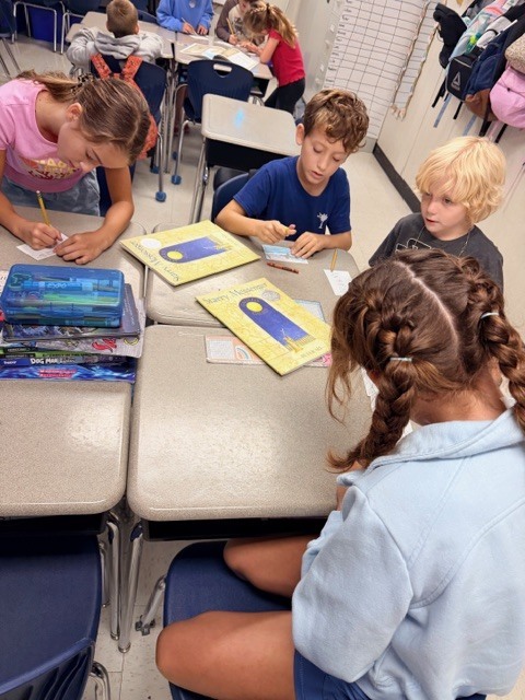 third graders working in small groups