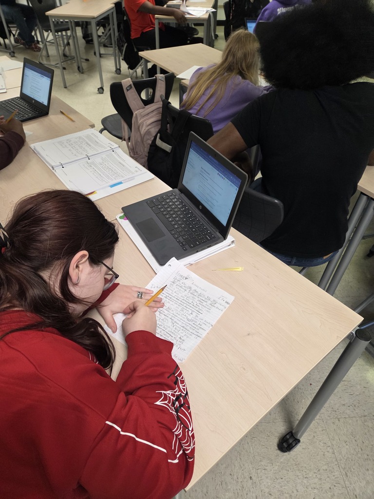 7th grade ELA students working on their literary analysis 