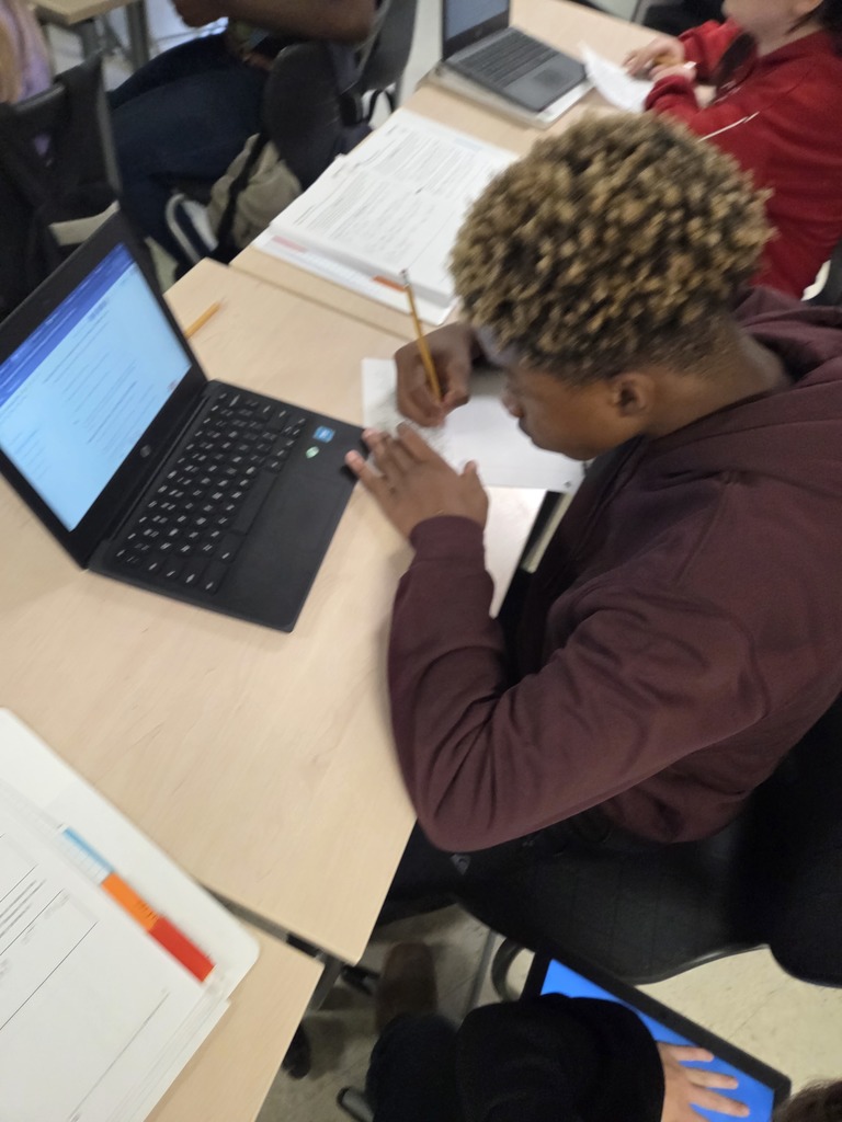 7th grade ELA students working on their literary analysis 