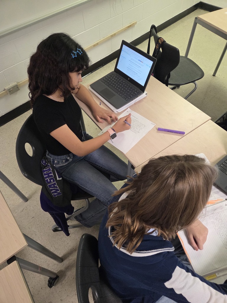 7th grade ELA students working on their literary analysis 