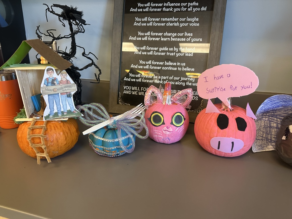 pumpkins decorated like story book characters