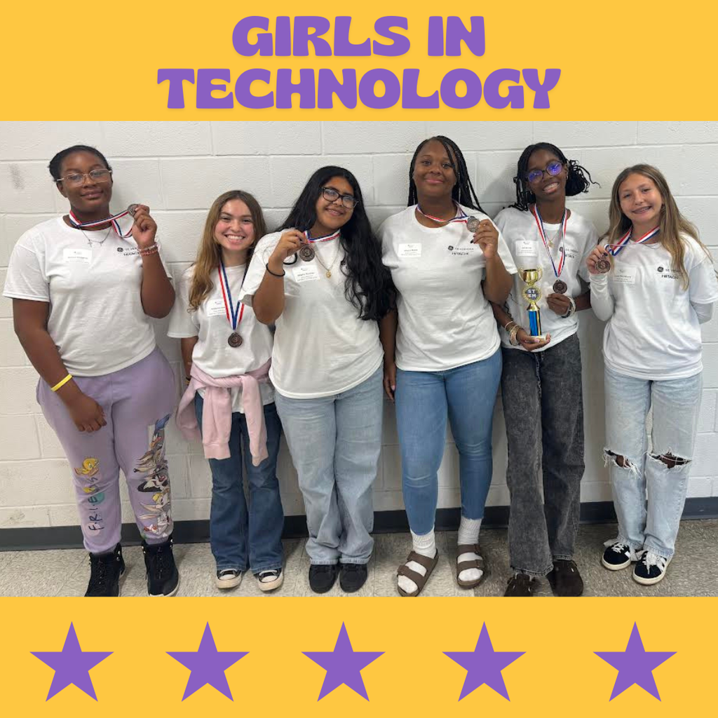 girls in technology group receiving third place medals and posing in photo