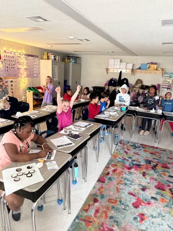 students making moon phases with Oreos