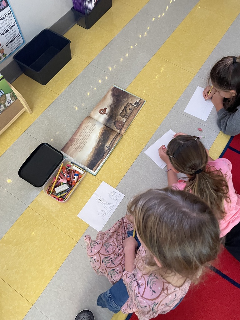 2nd graders working in small groups on a timeline project