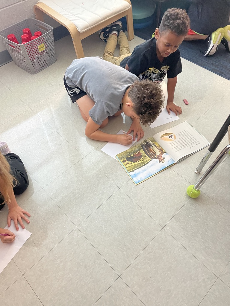 2nd graders working in small groups on a timeline project