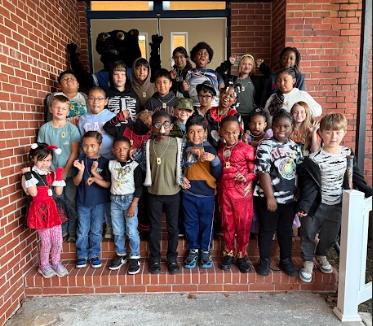 students of the week with silly faces and gestures being made