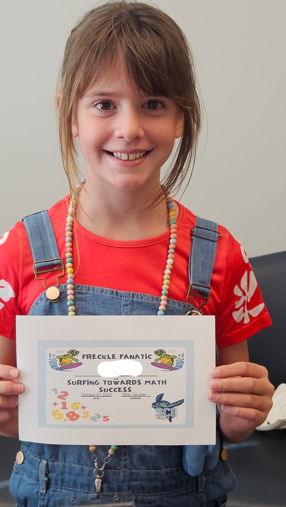 student holding a math certificate