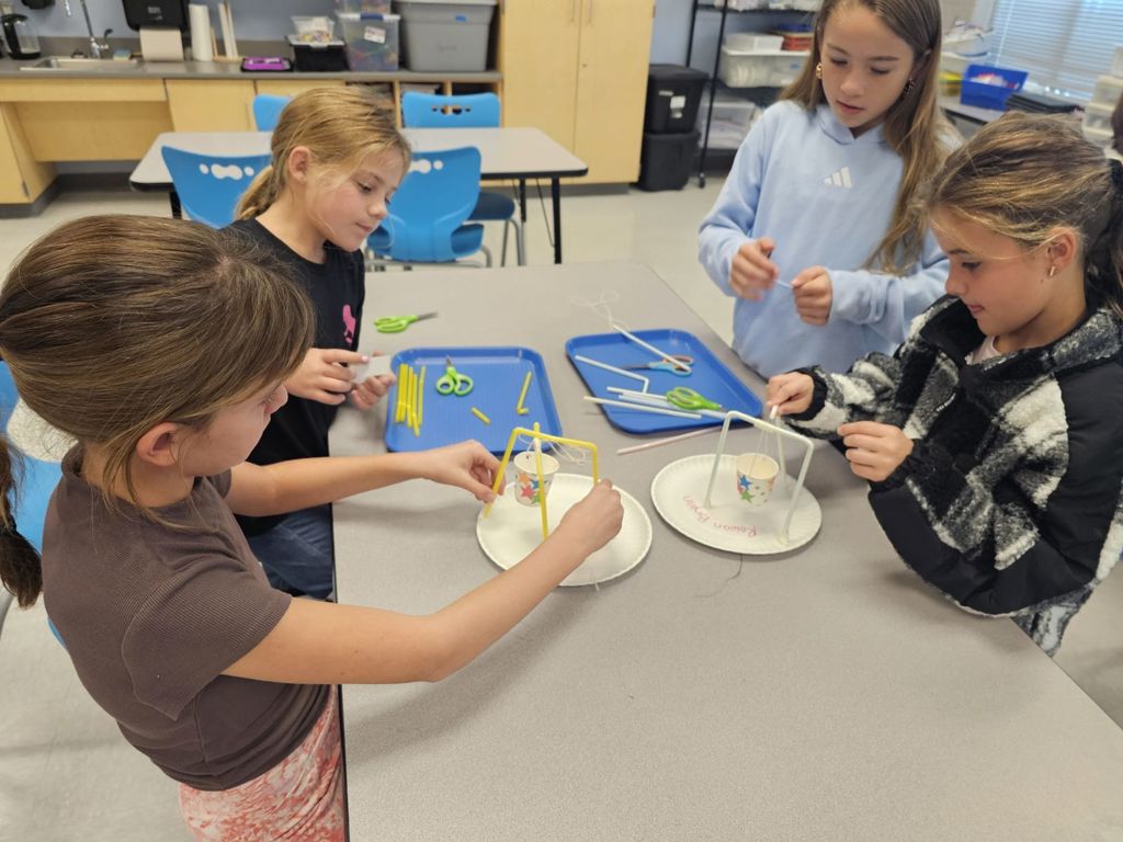 3rd graders working on a STEAM projects in small groups