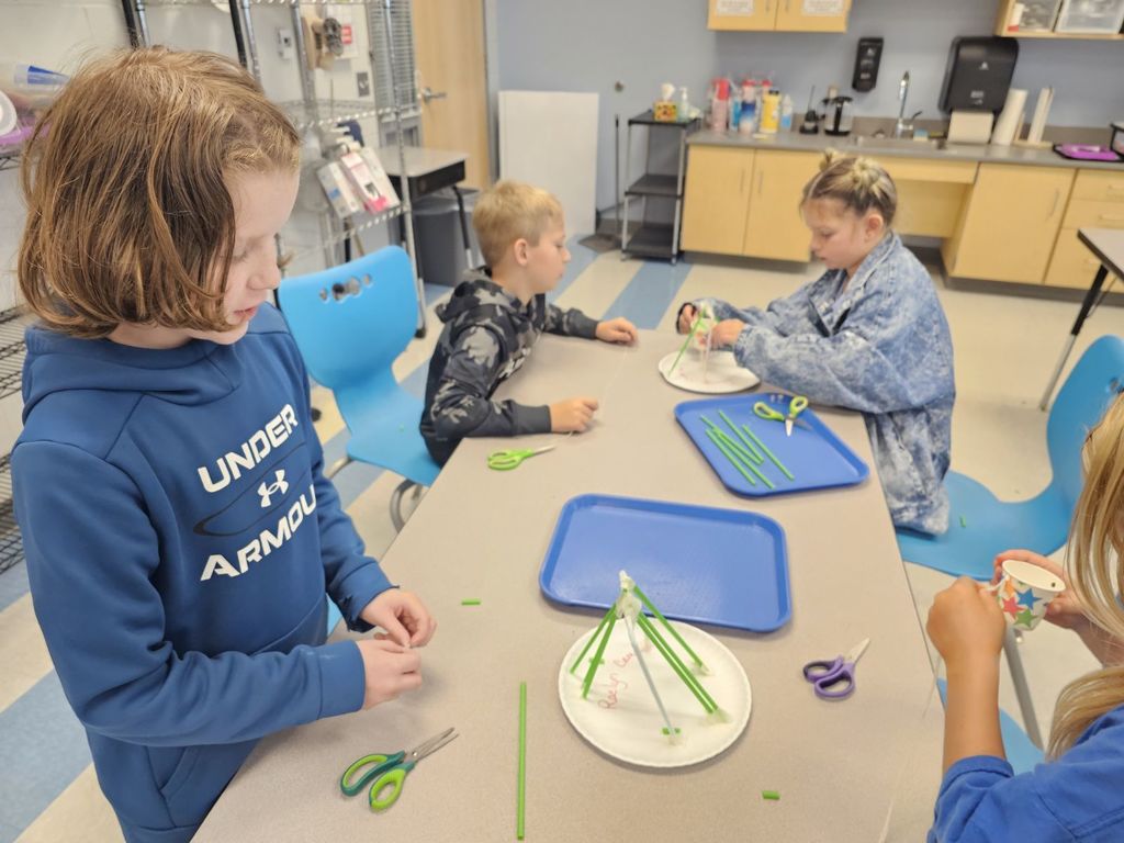3rd graders working on a STEAM projects in small groups
