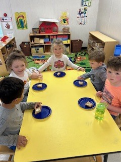 prek students eating bread that they made