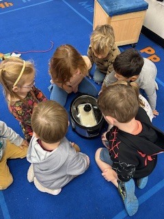 prek students making bread in a crockpot