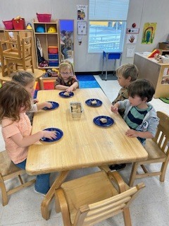 prek students eating bread that they made