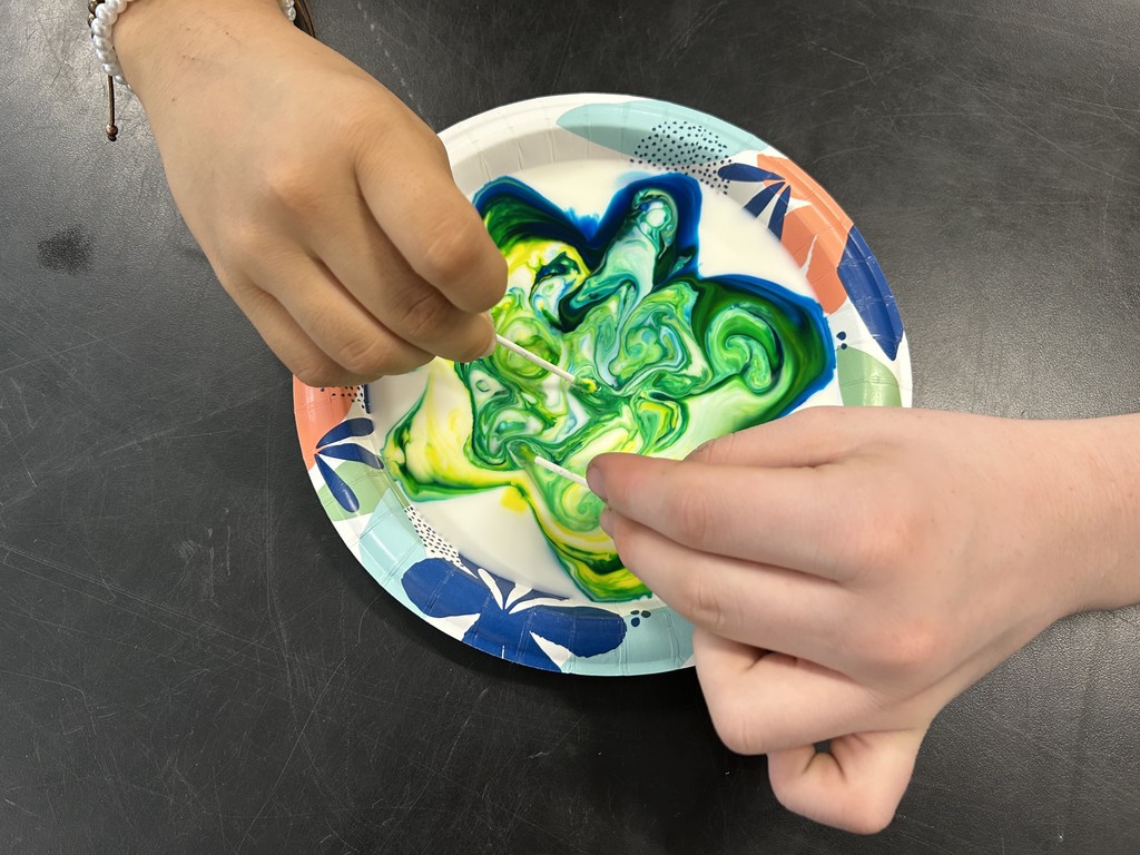 8th grade students conduct science experiments