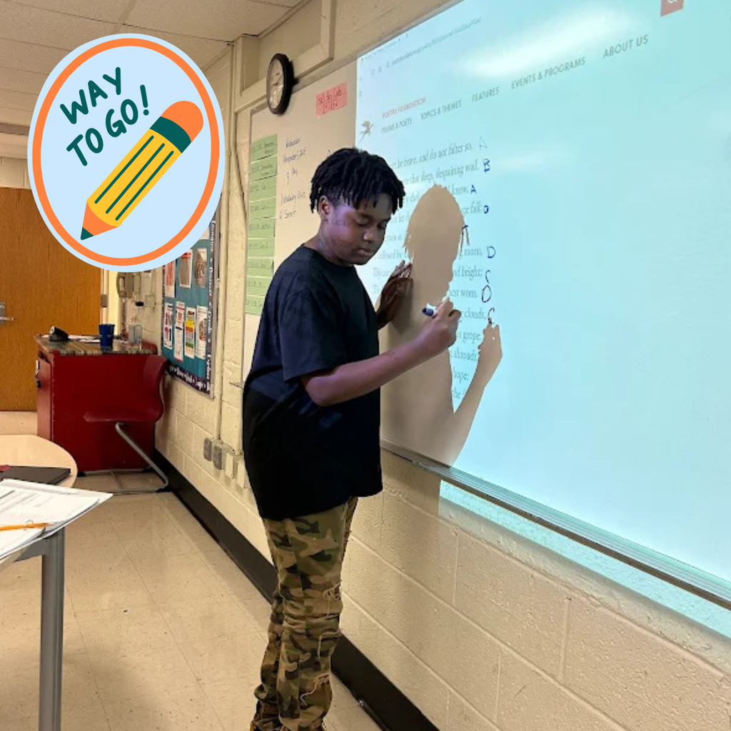 student working at board