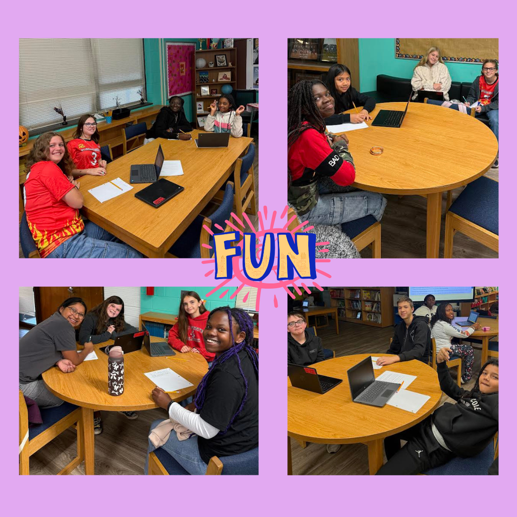 students working at tables in library