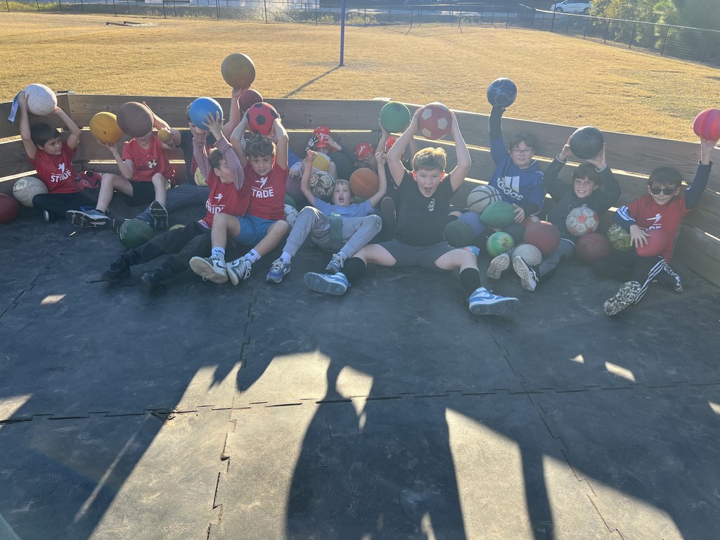 STRIDE running club information collecting sport balls from the retention pond