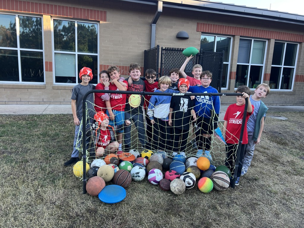 STRIDE running club information collecting sport balls from the retention pond