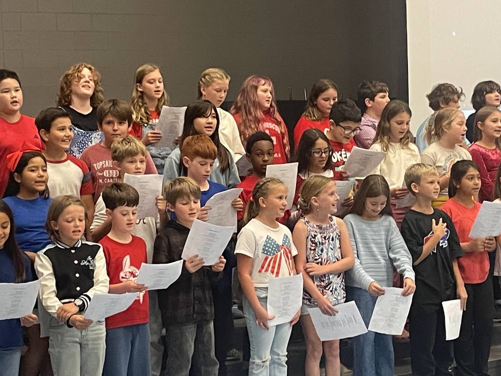 4th grade students singing at a Veterans Day concert