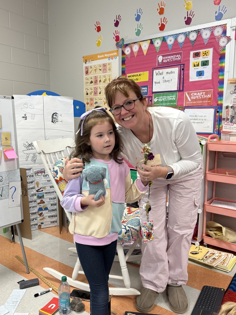 students giving flowers to staff members for world kindness day