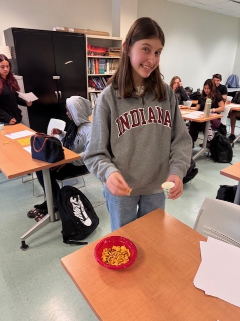 student working on lab by selecting goldfish