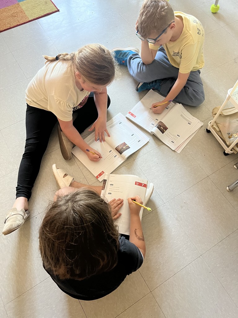 2nd graders working in groups on math problems