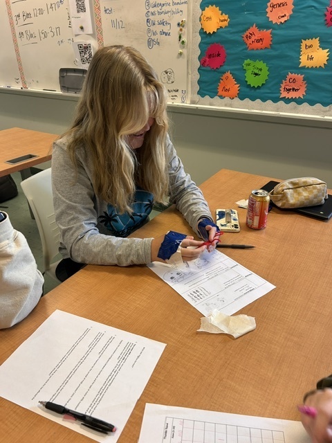 student ties a ribbon