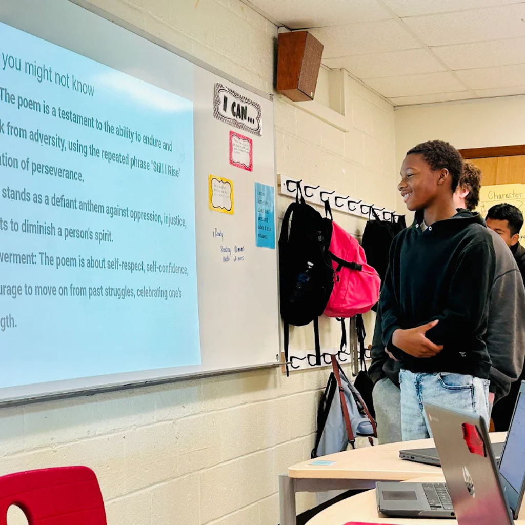 students standing at presentation board