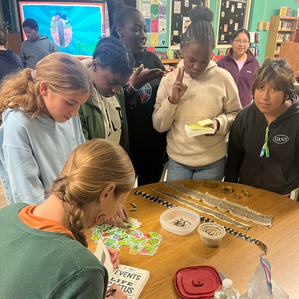 author signing books for students