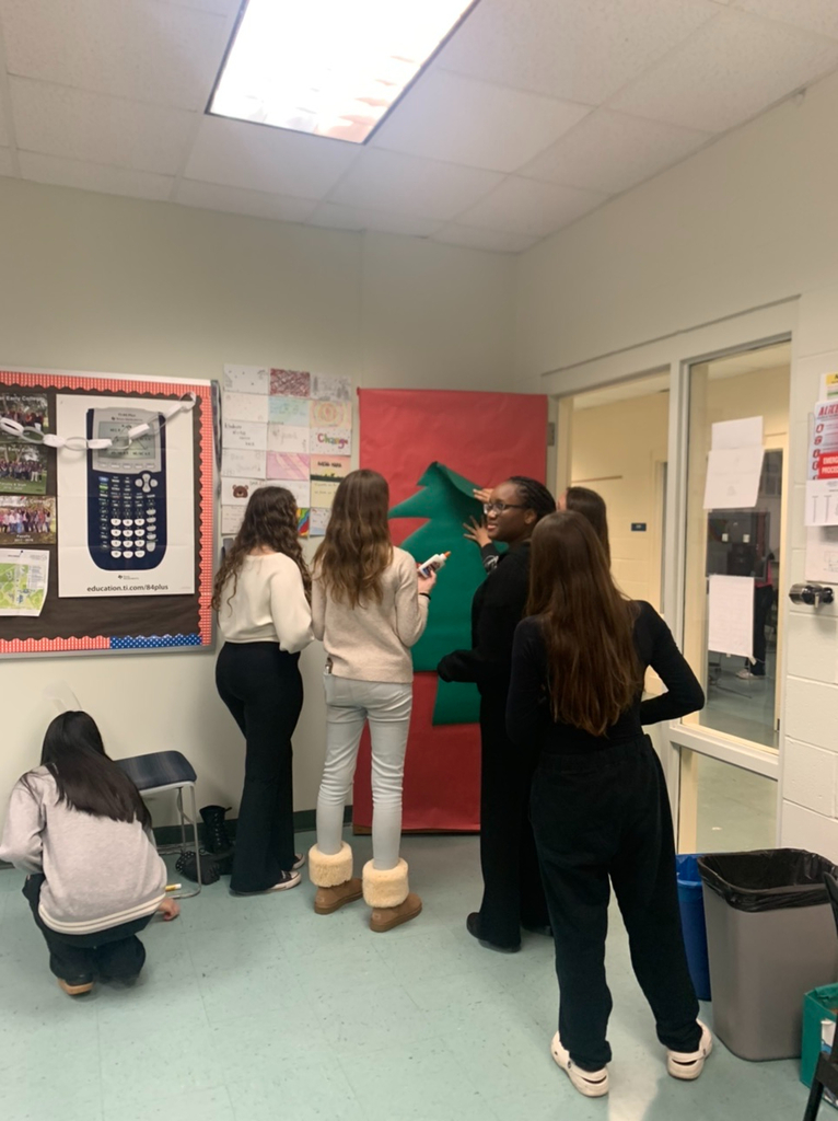 PECHS students decorating a door
