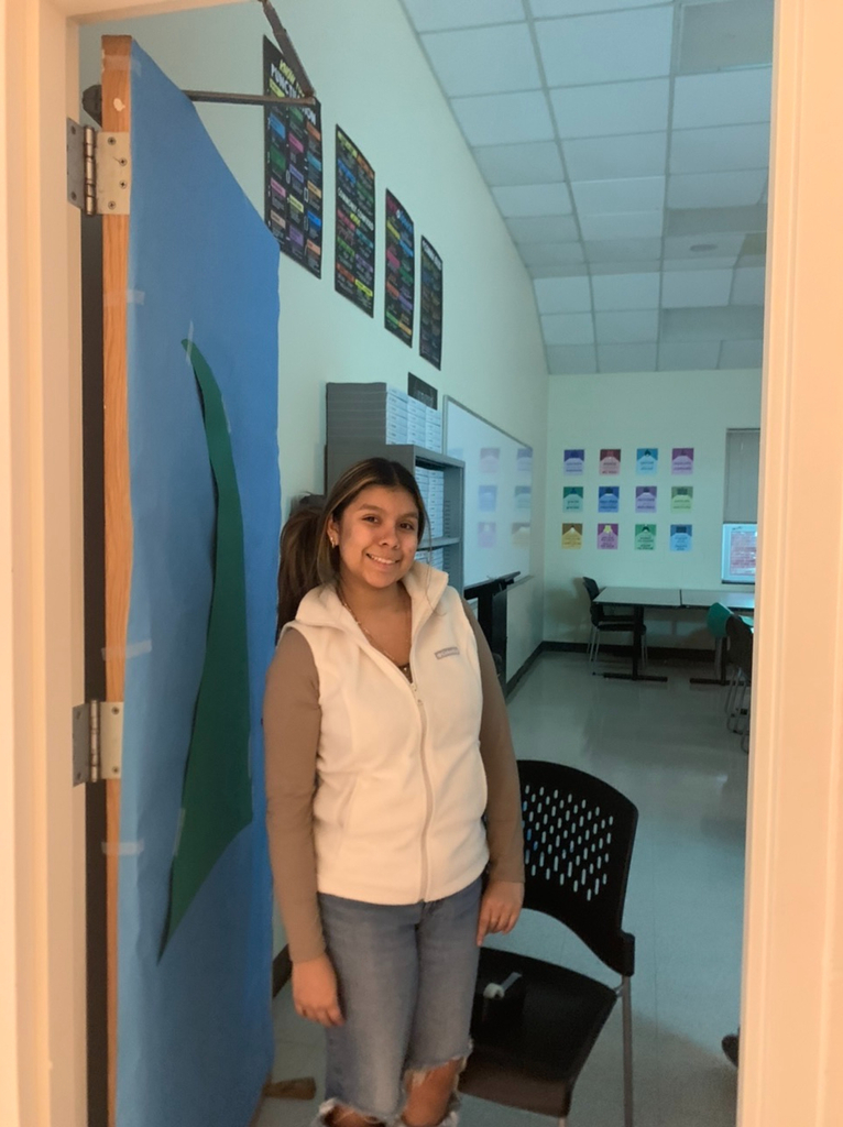 PECHS student decorating a door