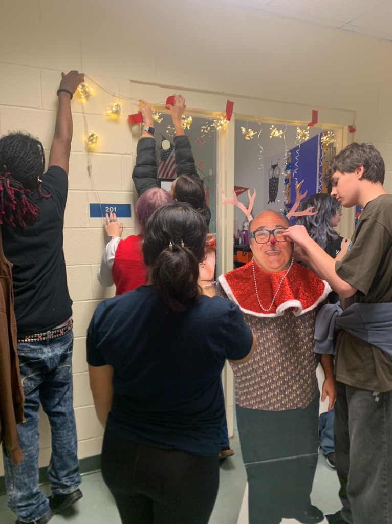 PECHS students decorating a door